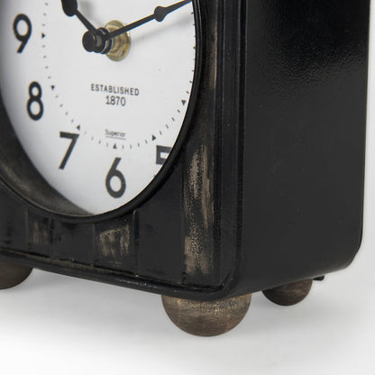 Karl 6.0L x 3.0W x 6.8H Rustic Black Iron Rounded Square Table Clock